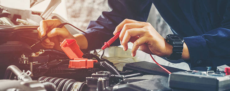 Hands of car mechanic  working in auto repair service.